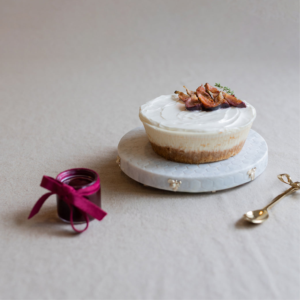 Small Honeyed Fig Cheesecake with Pomegranate Sauce